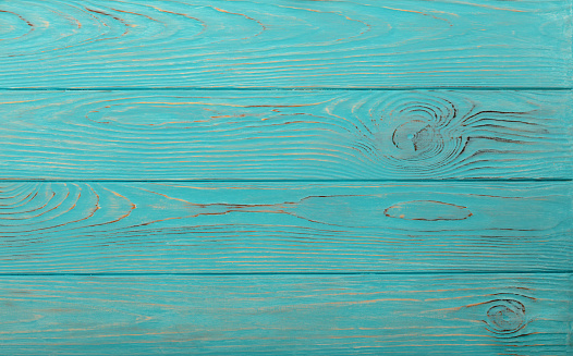 Wooden aged background of azure color. Selective focus.