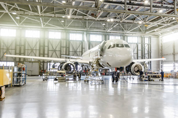 Passenger aircraft on maintenance of engine and fuselage repair in airport hangar Passenger aircraft on maintenance of engine and fuselage repair in airport hangar air vehicle photos stock pictures, royalty-free photos & images