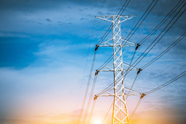 istock Electricity station. Close up high voltage power lines at sunset. 849234702