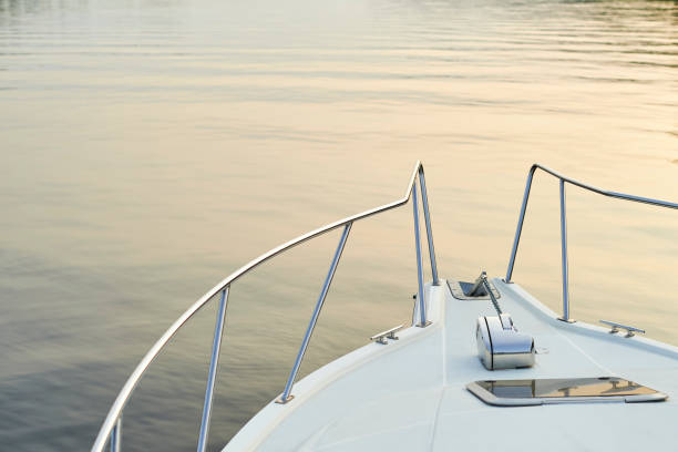 The nose of the ship against the evening river