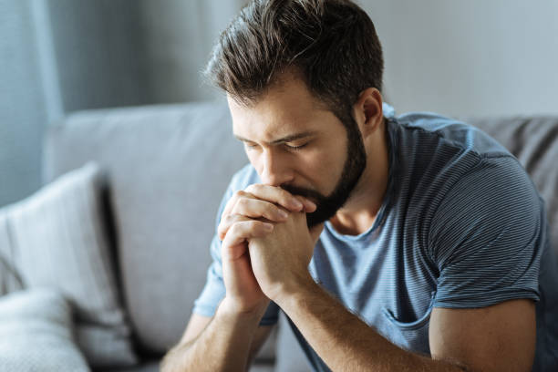 istock Unhappy young man holding his chin 849237924