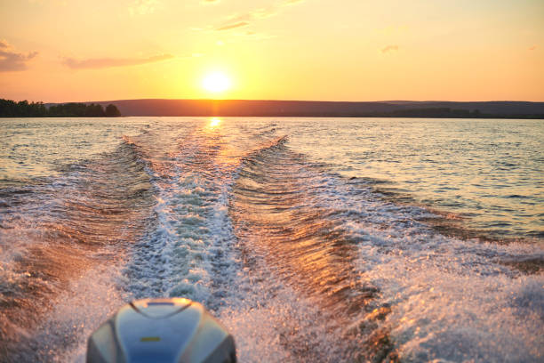 istock Trace from a boat on the river at sunset. 849238160