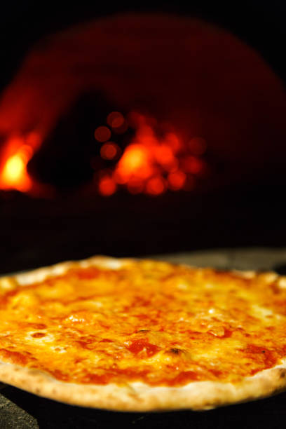 istock Fresh baked pizza with cheese near oven 849238674