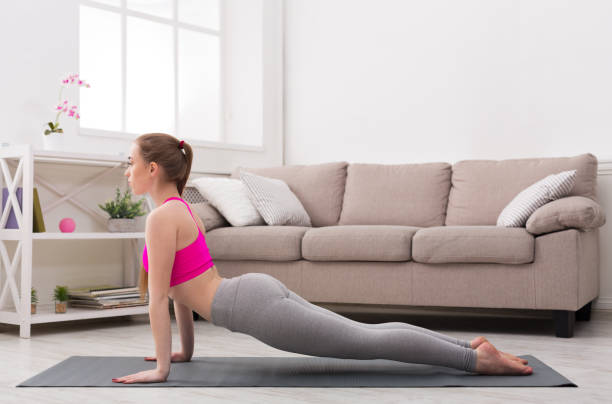 istock Woman training yoga in cobra pose. 849239690