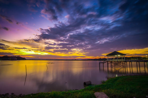 istock Wooden bridge at the sea at sunset 849242300