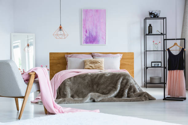 istock Painting hanging above double bed 849243234