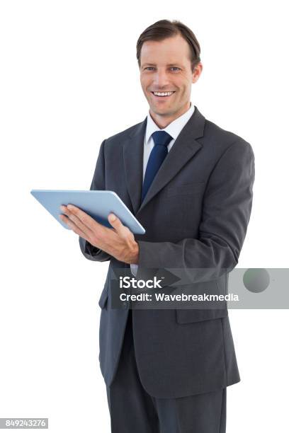 Lächelnd Geschäftsmann Mit Einem Tabletcomputer Stockfoto und mehr Bilder von 40-44 Jahre - 40-44 Jahre, Anzug, Berühren