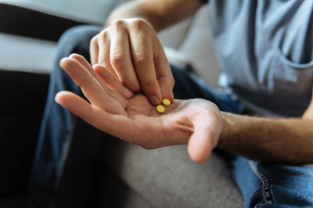 istock Selective focus of a male palm with pills 849243778