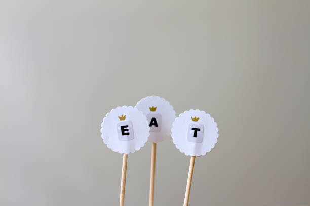 istock Toppers for cake decoration with word eat 849244164