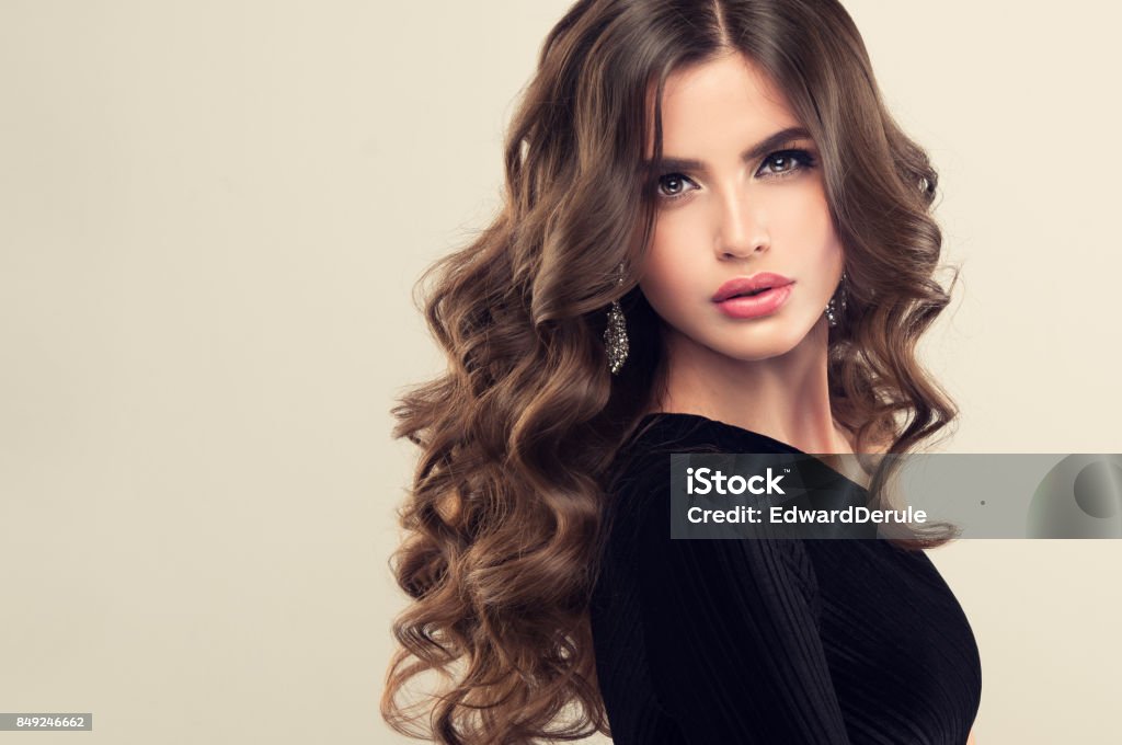 Brown Haired Woman With Voluminous Shiny And Curly Hairstylefrizzy Hair  Stock Photo - Download Image Now - iStock