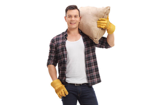 istock Agricultural worker holding a burlap sack 849249050