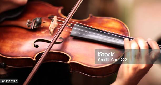 A Person Playing The Violin Showing Hands Holding The Bow Stock Photo - Download Image Now