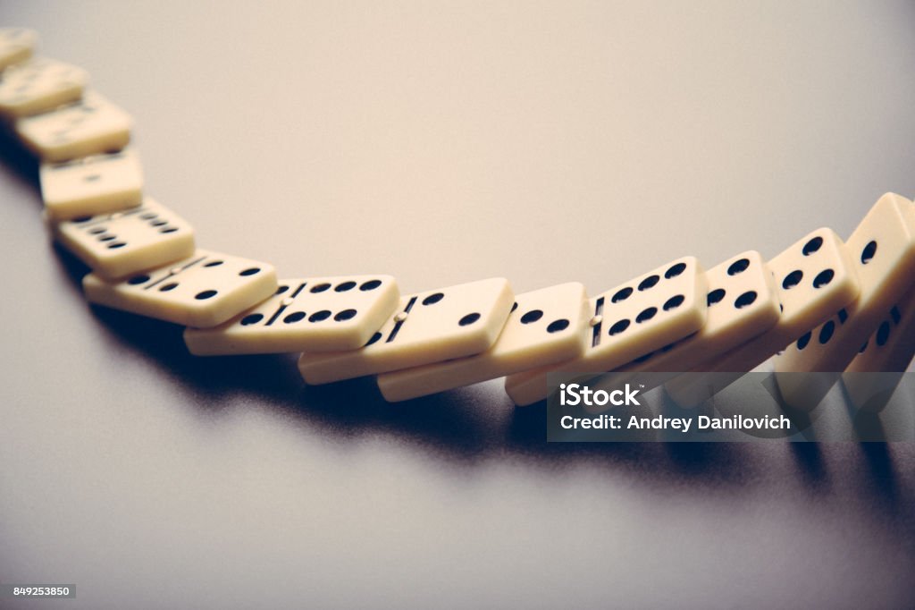Dominos standing in a line Dominos on the black table Domino Stock Photo