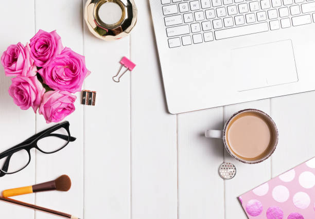 istock Modern stylish feminine workplace with coffee and roses 849254208