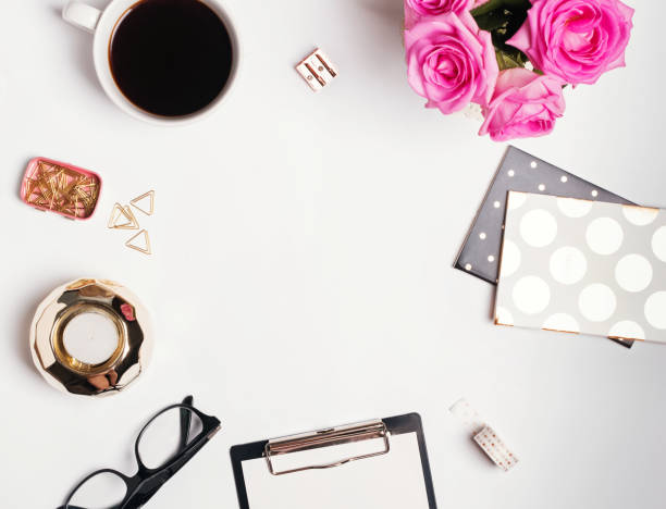 istock Feminine workplace concept: cofee, roses and small gold color accessories 849254214
