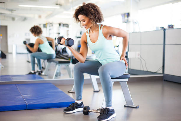 istock Young Woman Weightraining at the Gym 849254368