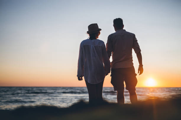istock Young couple at beach in sunset 849254780