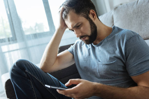 istock Pleasant sad man touching his hair 849254954
