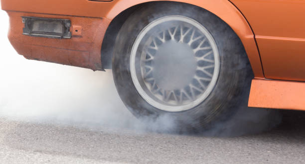 istock Smoke from under the wheels of the car 849257982