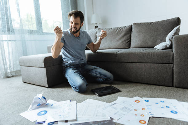 istock Angry desperate man sitting on his knees 849258700