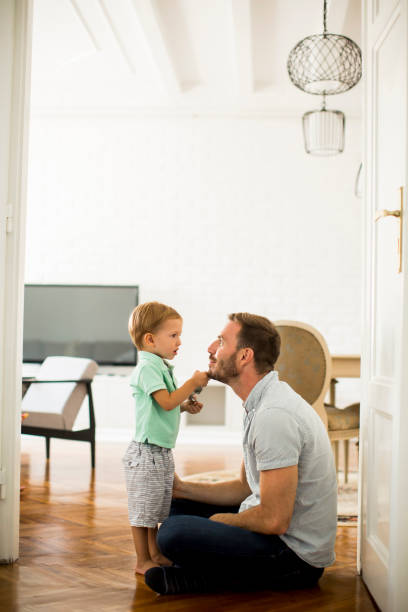 istock Happy father with his son playing at home 849258840