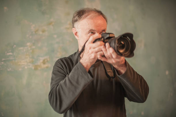 istock Senior Male Photographer by Work 849259664