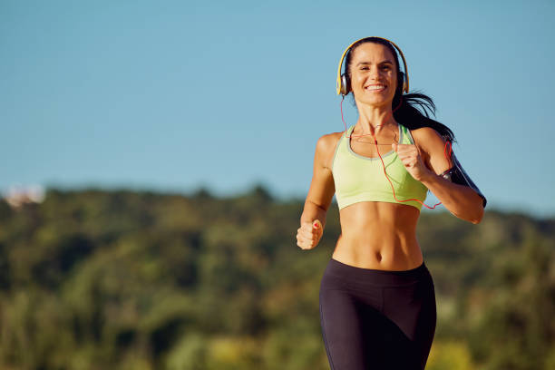 istock A young woman runner runs in a park in the park. 849269638