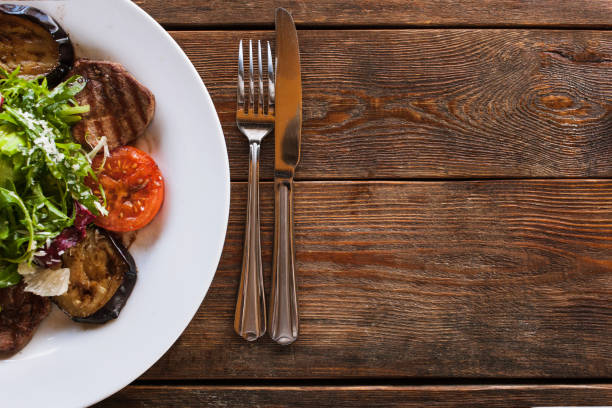 istock Medallions with grilled vegetables on white plate 849274632