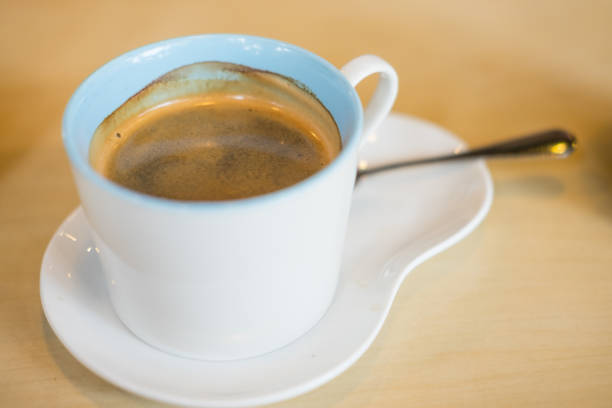 istock Cup of hot coffee on wood table 849278112