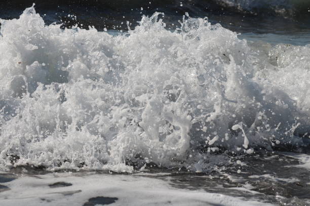 Waves and water puddle Sea Waves hava stock pictures, royalty-free photos & images