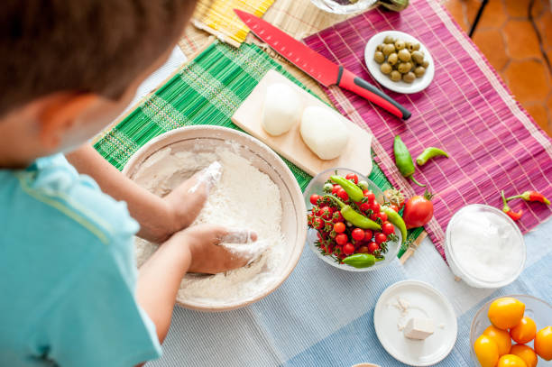 istock High Angle View Of Boy Hands Preparing Pizza Dough  Step By Step 849287652