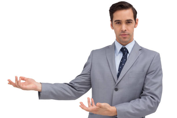 istock Serious businessman presenting something with his hands 849293102
