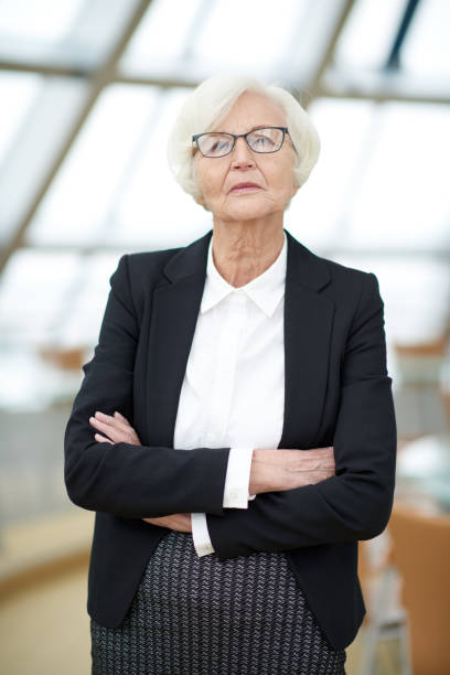 istock Confident senior female financier 849294282