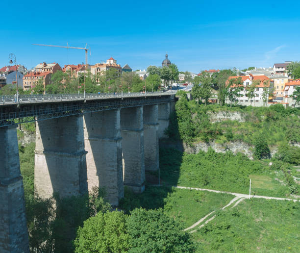 istock Ancient stone bridge over the river. High bridge. Deep canyon. 849297442