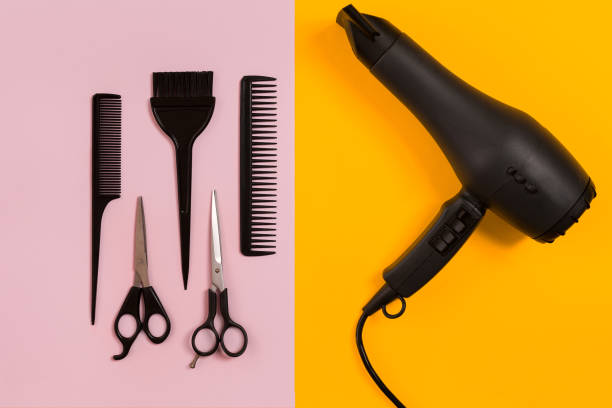 istock Combs and hairdresser tools on color background top view 849302560