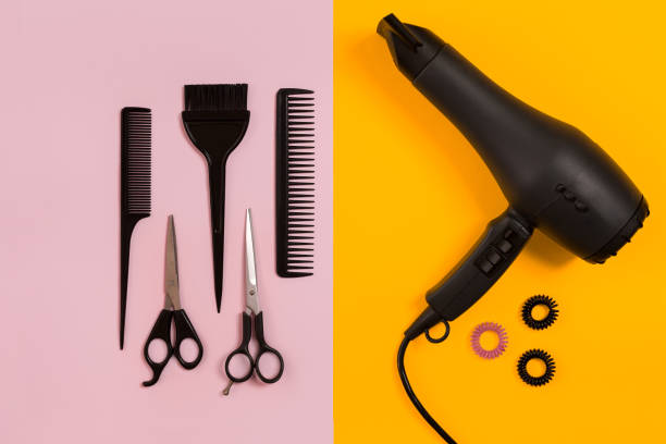 istock Combs and hairdresser tools on color background top view 849302692