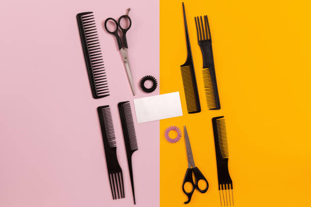 istock Combs and hairdresser tools on color background top view 849302882