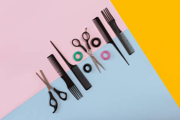 istock Combs and hairdresser tools on color background top view 849302986