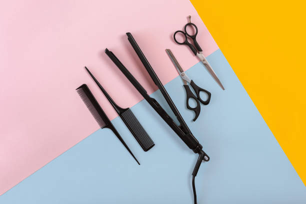 istock Combs and hairdresser tools on color background top view 849305280