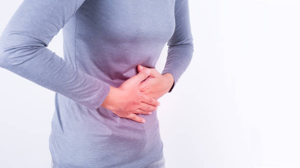 istock asian woman having stomachache on white background 849305408