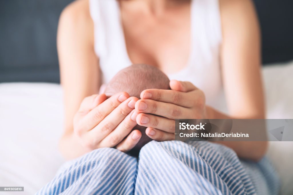 Mother and newborn baby. Mother and newborn baby. Baby care. Mom and child's first month of life at home. Image of happy maternity and family. Childbirth Stock Photo