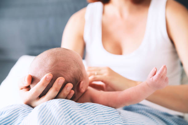istock Mother and newborn baby. 849305832