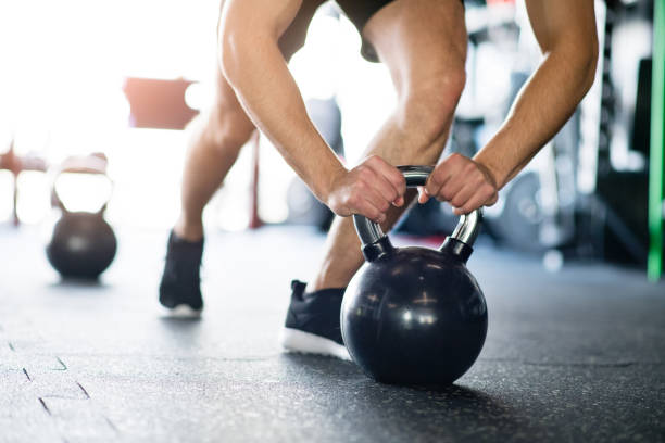 istock Unrecognizable fit man in gym doing push ups on kettlebells 849306694
