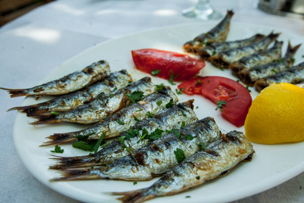 istock Barbequed Sardines on white plate. 849306900