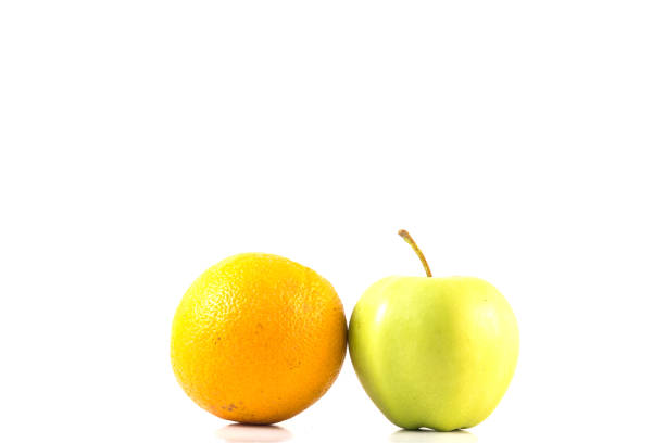 istock Green apple and orange isolated on white background 849307202