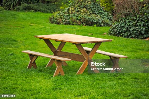 Picnic Table On A Green Meadow Stock Photo - Download Image Now - Picnic Table, Wood - Material, Woodland