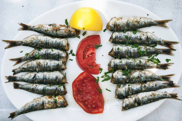 istock Barbequed Sardines on white plate. 849313338