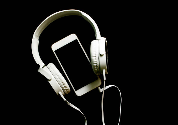 istock White smartphone and headphones banner template with text place. 849313626