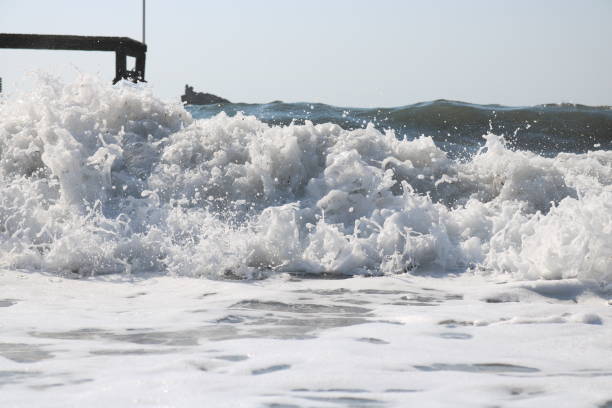 Waves and water puddle Sea Waves hava stock pictures, royalty-free photos & images