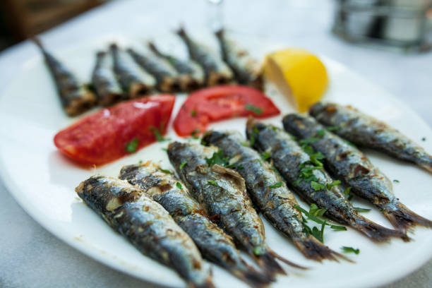 istock Barbequed Sardines on white plate. 849318814